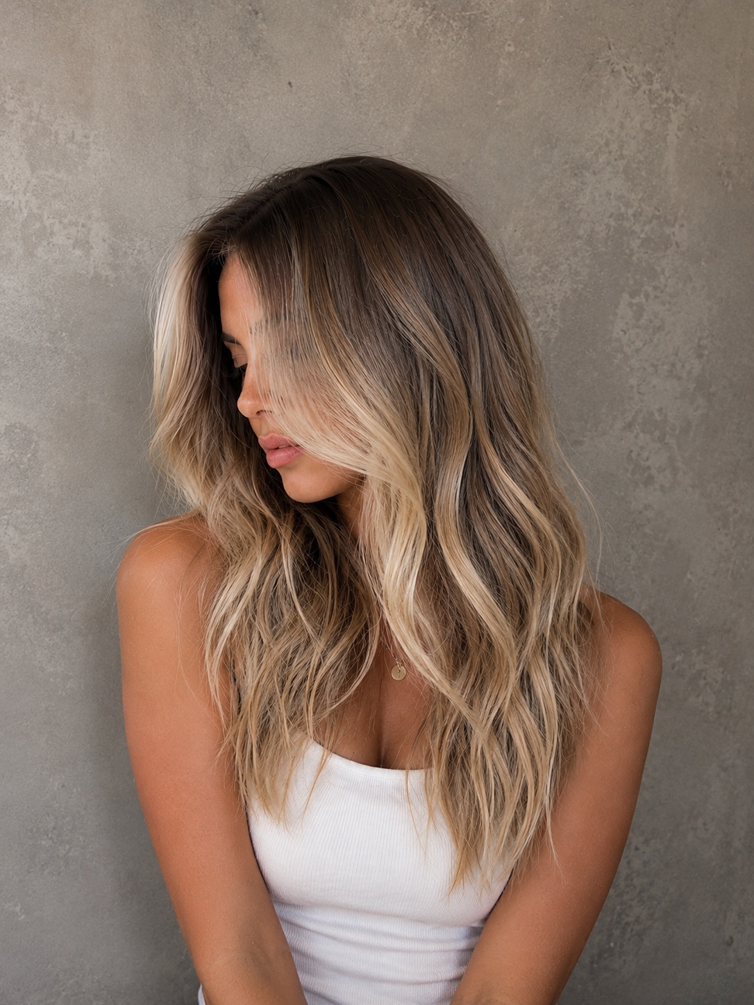 Hair extension installation process at Katie Shumway's private Dana Point studio